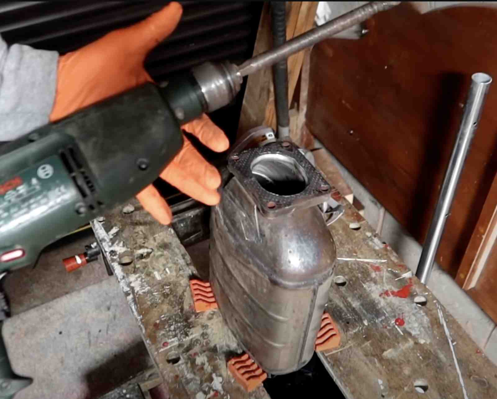Engine internals coated in black sludge with a valve spring visible