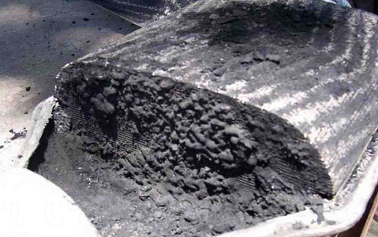 Lump of hard carbon deposit removed from the exhaust system