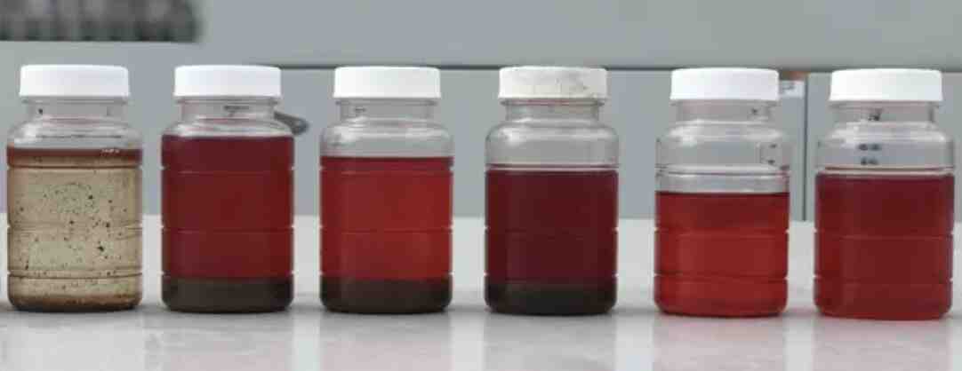 Fuel samples in bottles lined up for colour comparison