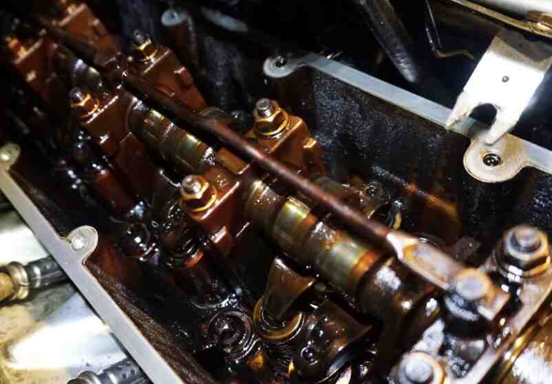 Black sludge deposited on engine components